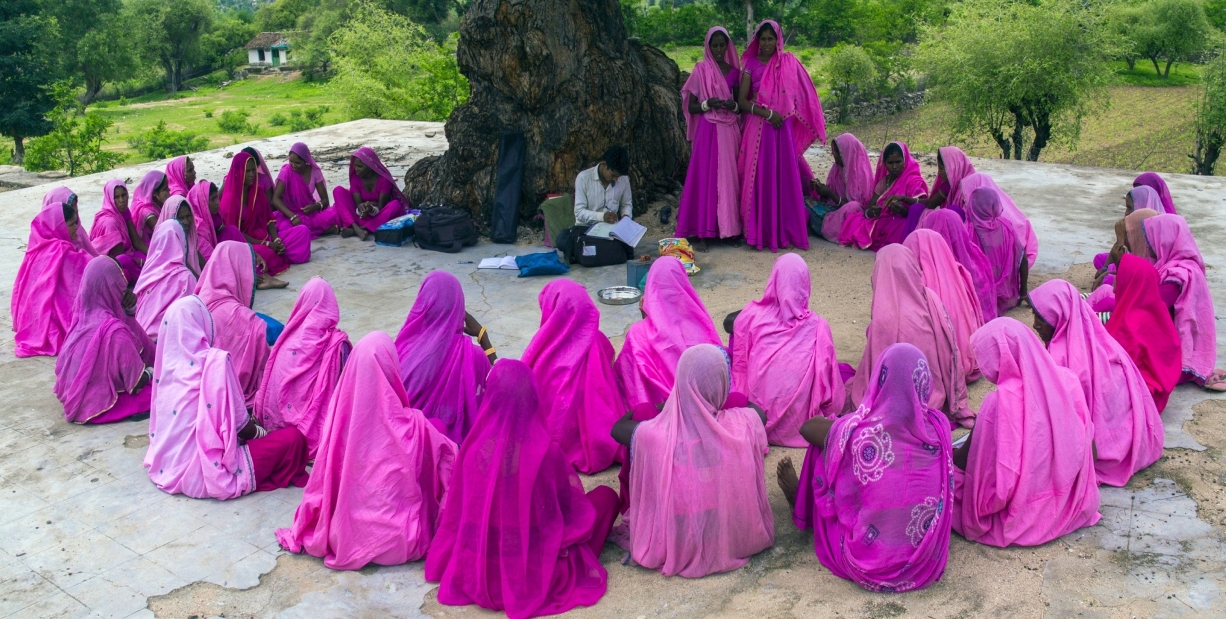 Women leading community meetings